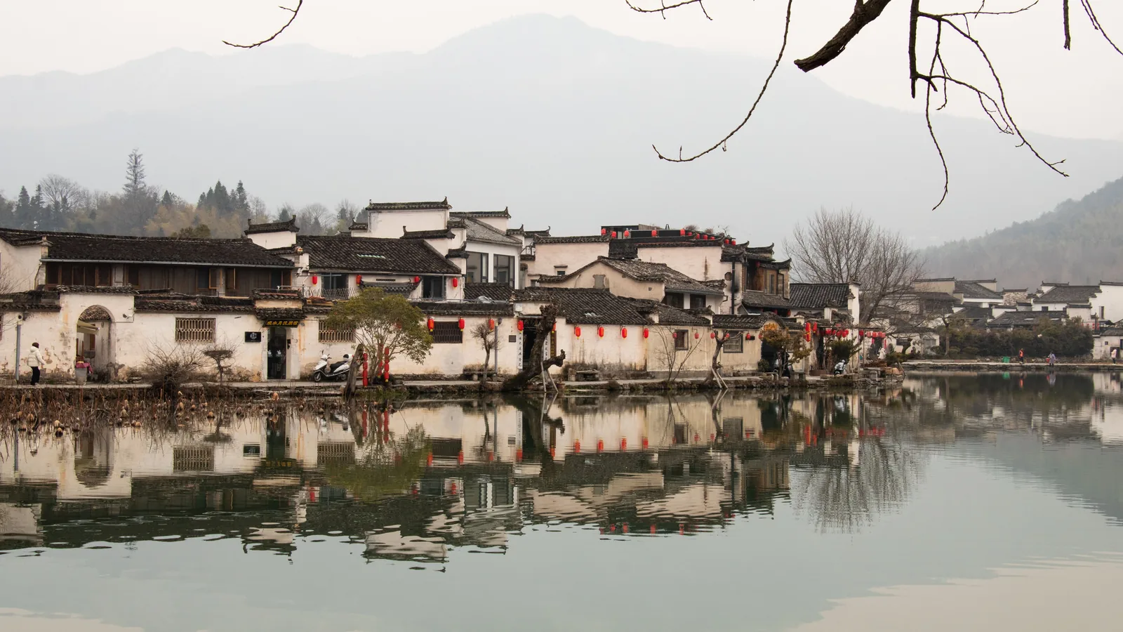 `Traditional village beside calm water in Huangshan, Anhui`